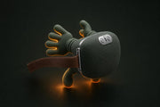 Massager with warm amber heat glow on a dark background